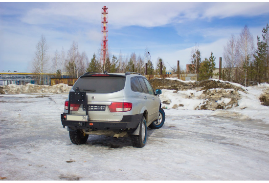 Бампер силовой задний OJ серии "ТРОФИ" для SsangYong Kyron 2007-2016 с калиткой под запаску и квадратом под фаркоп
